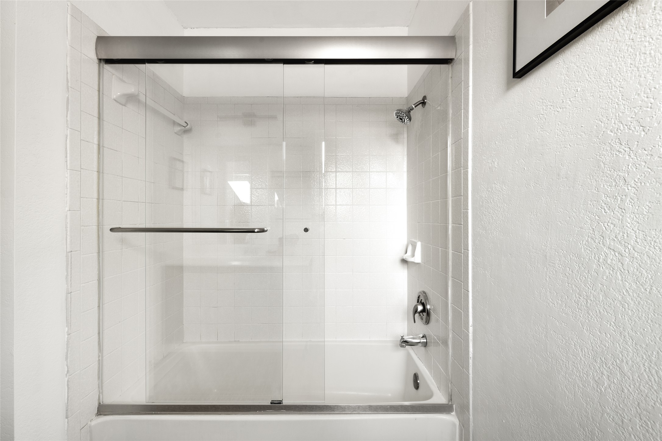 8504 Verona Trail Austin, TX 78749 - Photo 25 of 32 a bathroom with a glass shower door