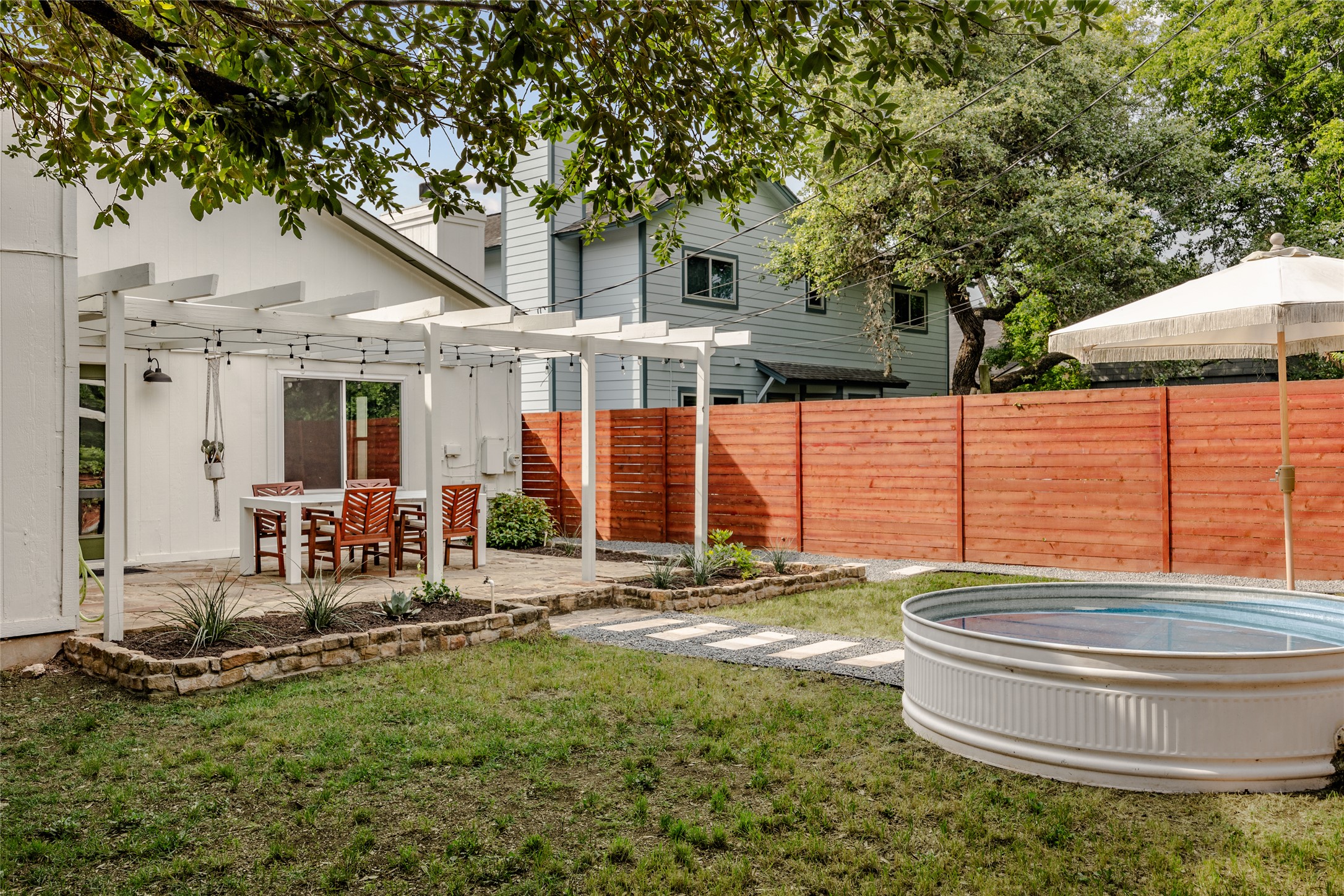 8504 Verona Trail Austin, TX 78749 - Photo 30 of 32 a backyard of a house with table and chairs