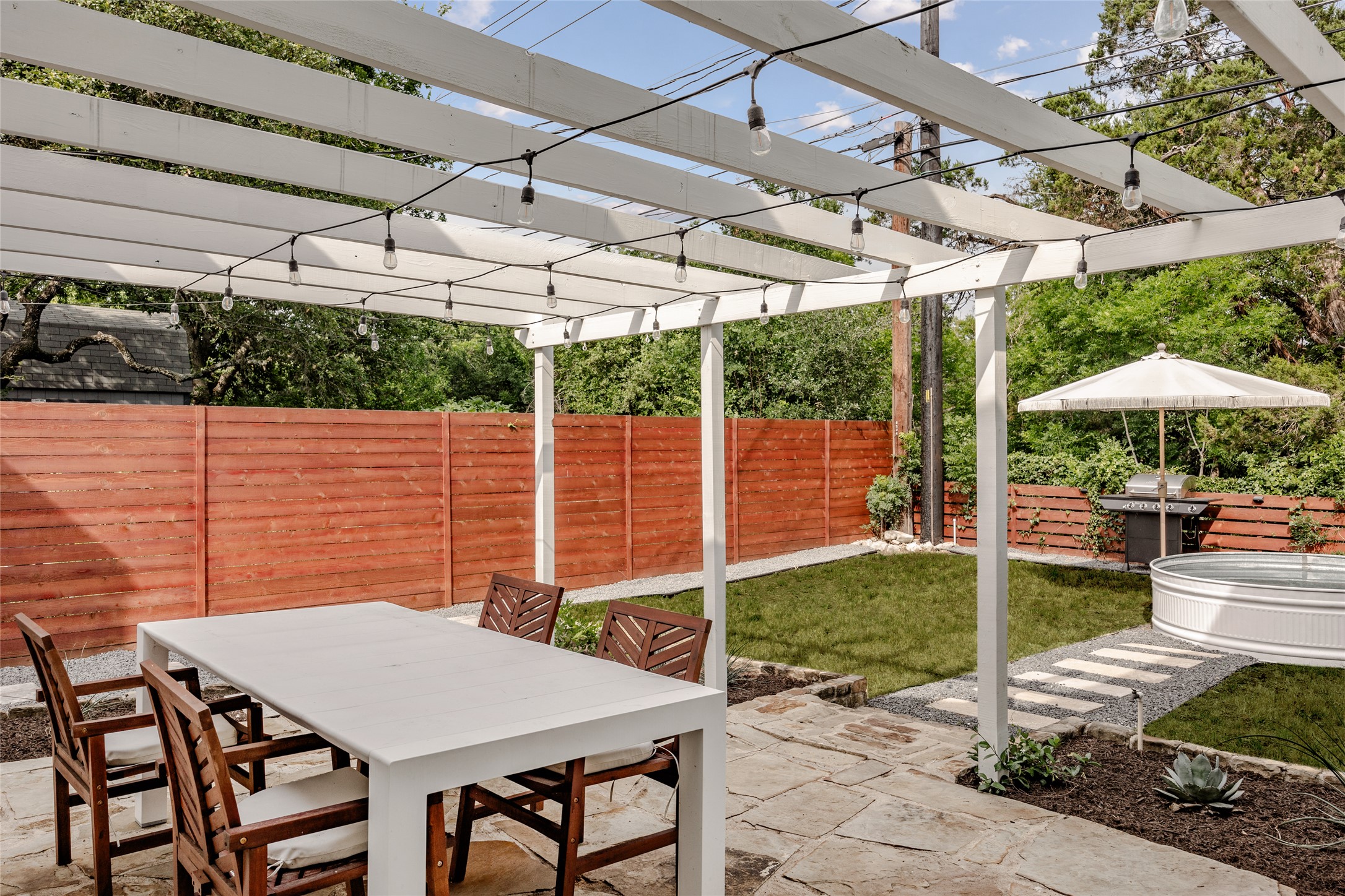 8504 Verona Trail Austin, TX 78749 - Photo 31 of 32 a view of a patio with a table chairs and a backyard