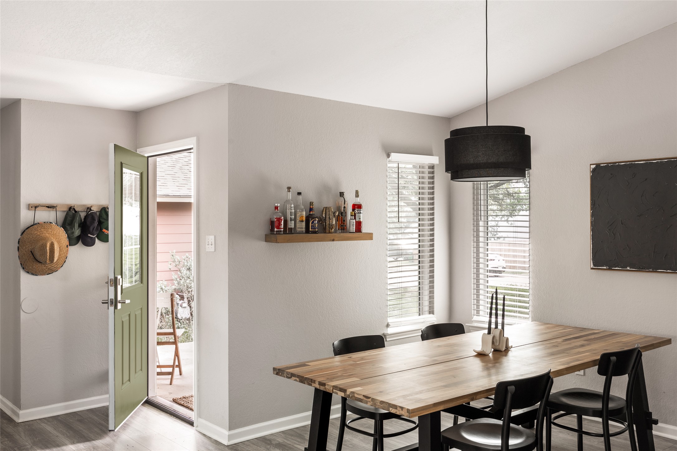 8504 Verona Trail Austin, TX 78749 - Photo 4 of 32 a view of a dining room with furniture window and wooden floor