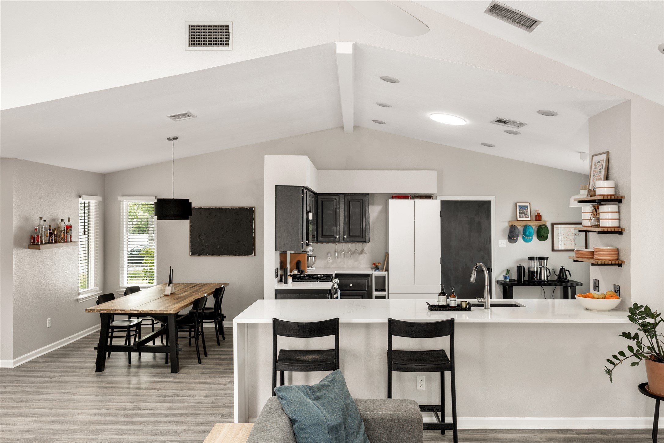 8504 Verona Trail Austin, TX 78749 - Photo 6 of 32 a kitchen with stainless steel appliances kitchen island granite top and refrigerator