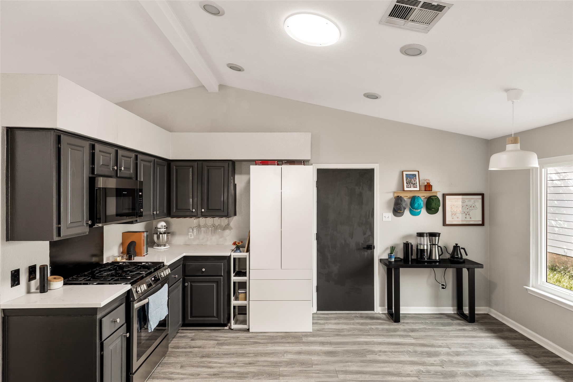8504 Verona Trail Austin, TX 78749 - Photo 7 of 32 a kitchen with stainless steel appliances granite countertop a stove refrigerator and a sink