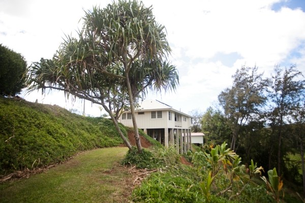3765 Omao Road, Unit B Koloa, HI 96756 - Photo 3 of 16 a front view of a house with a garden