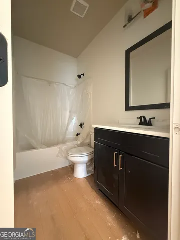 a bathroom with a sink a toilet and a bathtub
