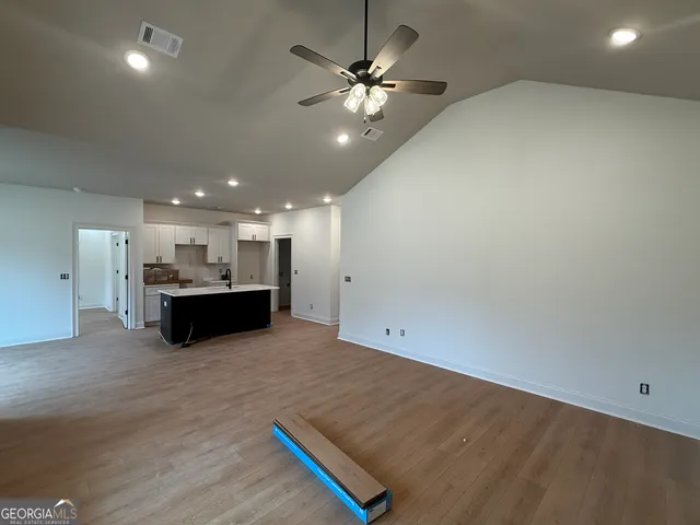 a view of kitchen and kitchen with sink
