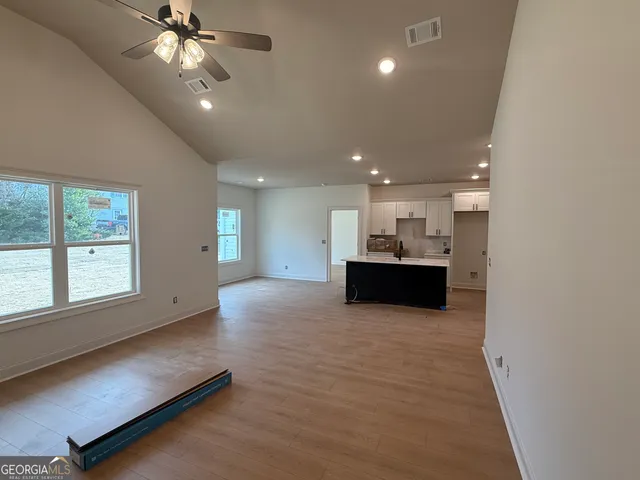 a view of a kitchen with a sink and a window
