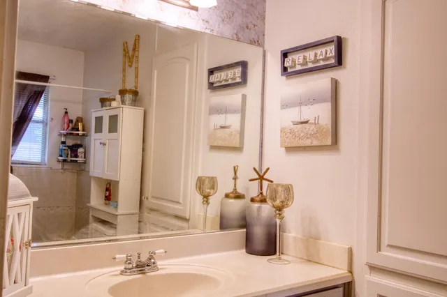 a bathroom with a sink and a mirror