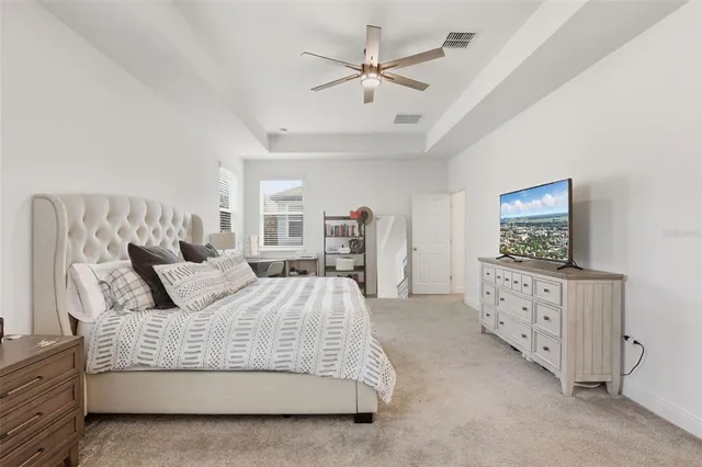 a bedroom with furniture and window