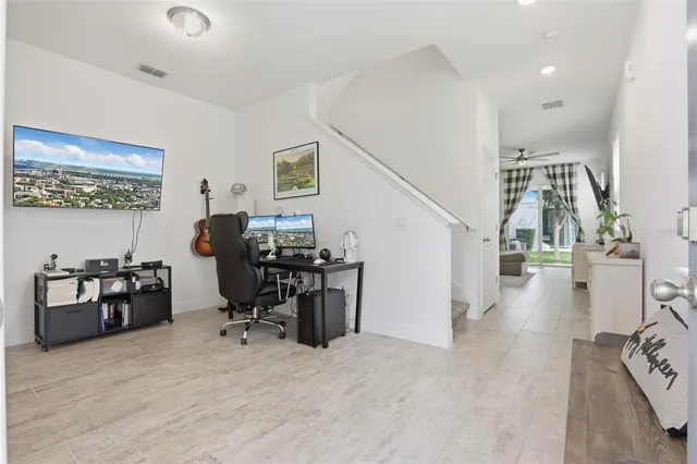 a view of a workspace with furniture and a workspace