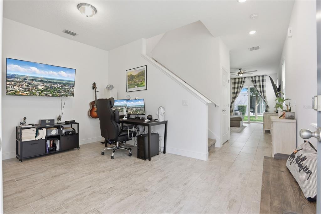 2420 Firstlight Way Winter Park, FL 32792 - Photo 2 of 48 a view of a workspace with furniture and a workspace
