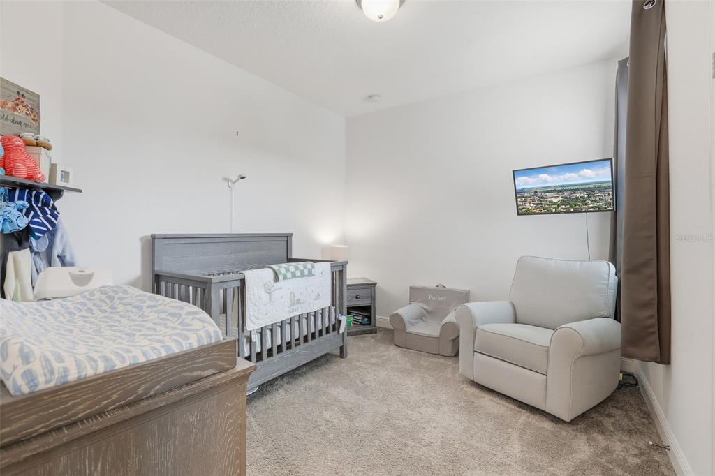 2420 Firstlight Way Winter Park, FL 32792 - Photo 21 of 48 a bedroom with furniture and a couch