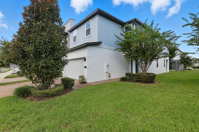 a front view of house with yard and green space