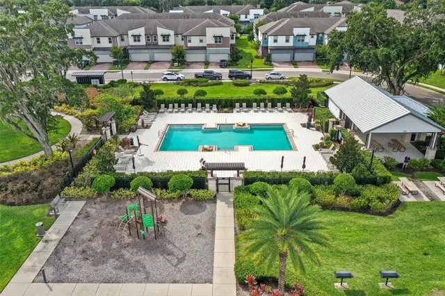 an aerial view of multiple houses with yard