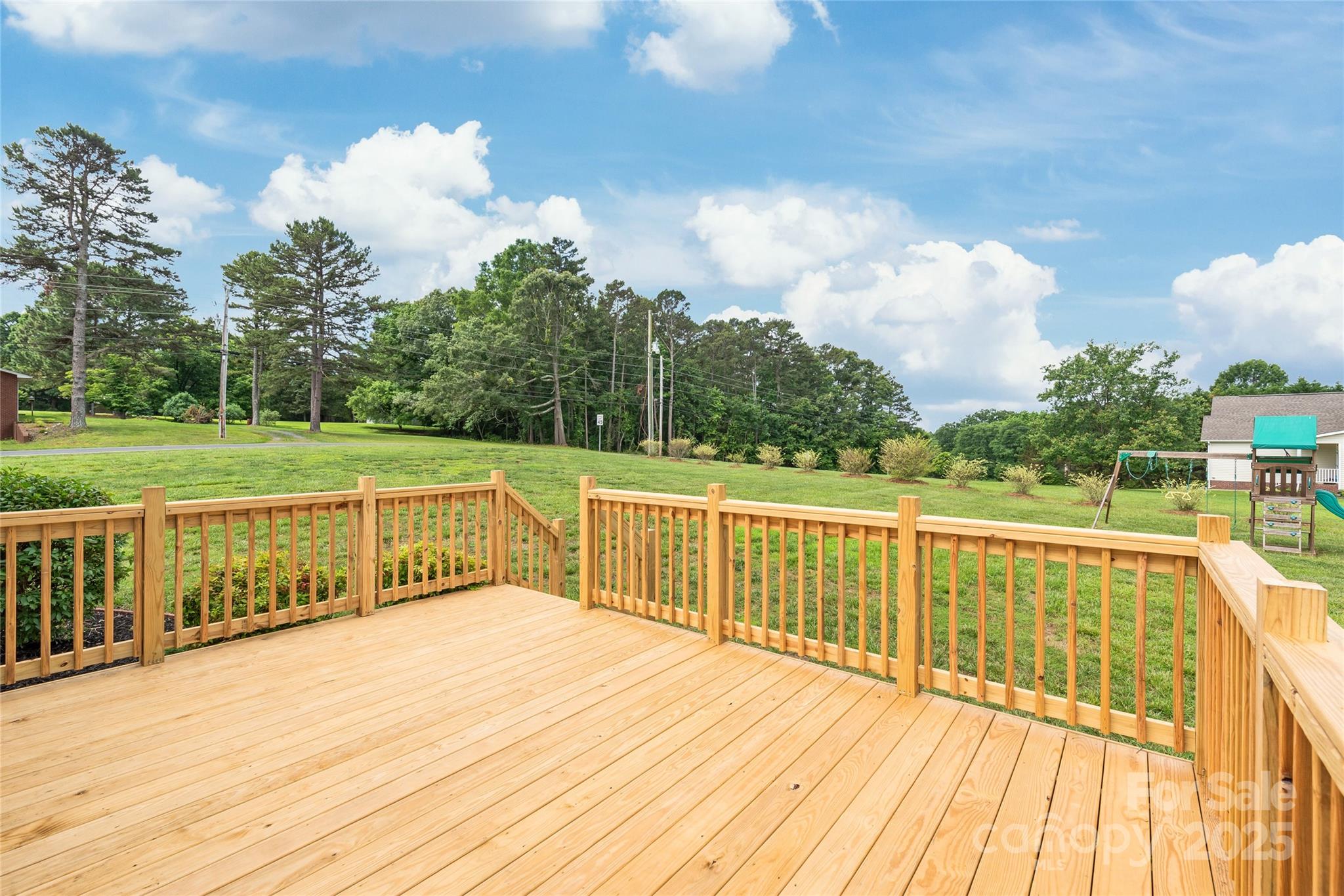 8717 Swift Road Oakboro, NC 28129 - Photo 18 of 23 a view of a balcony with wooden floor
