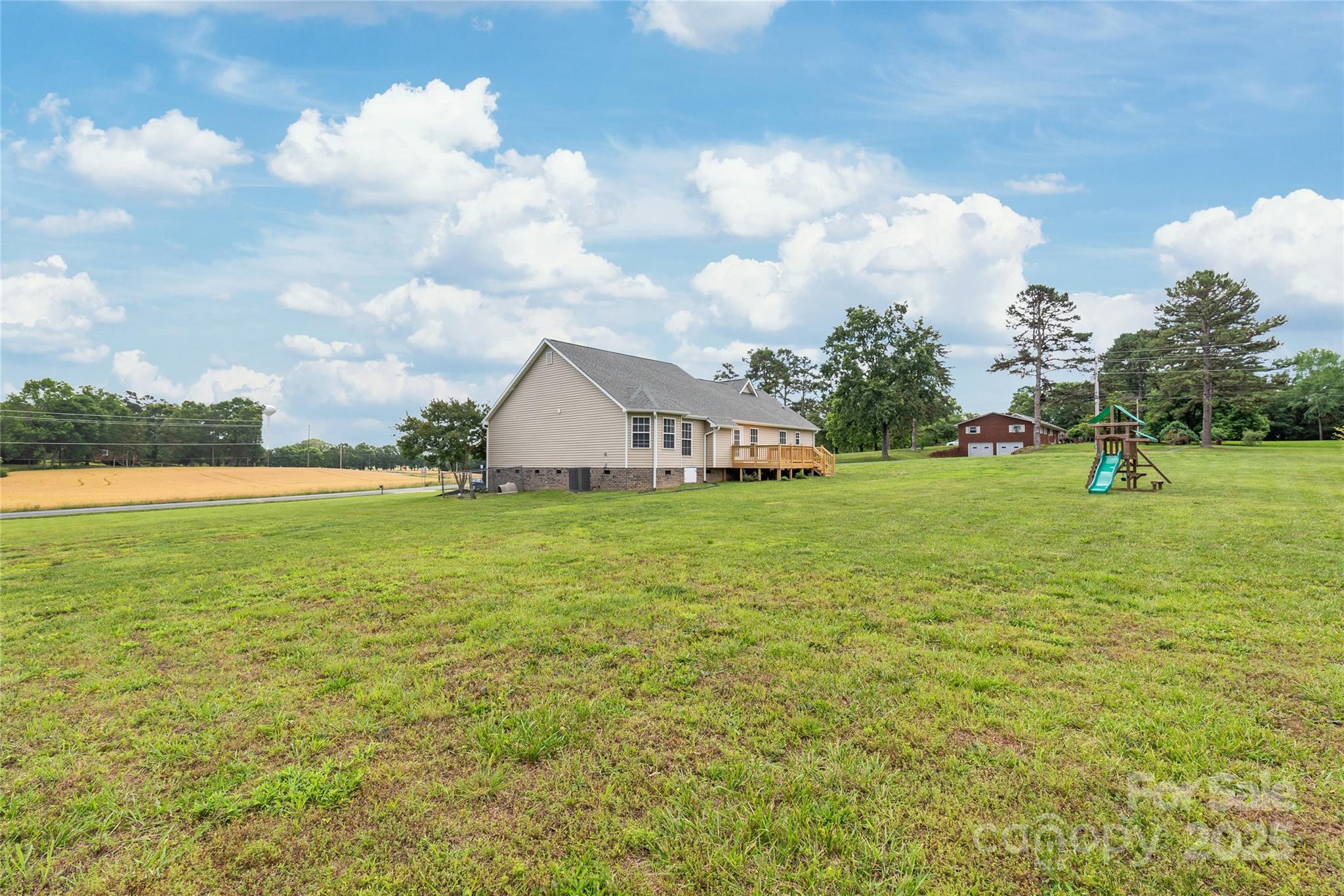 8717 Swift Road Oakboro, NC 28129 - Photo 20 of 23 a view of a house with a yard and lake view