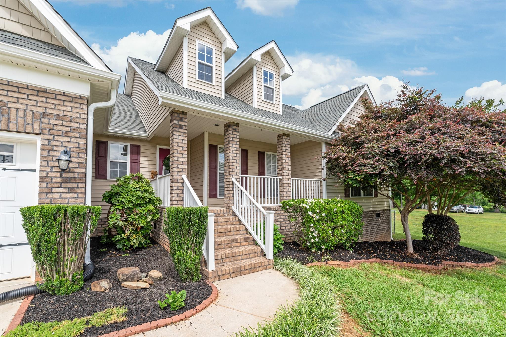 8717 Swift Road Oakboro, NC 28129 - Photo 2 of 23 a front view of a house with garden