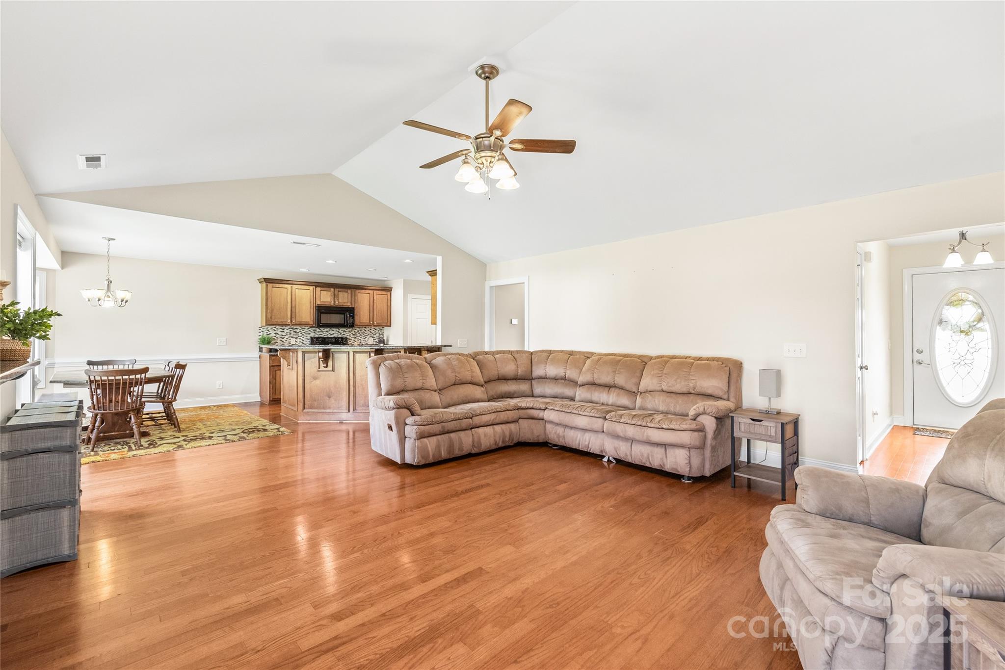 8717 Swift Road Oakboro, NC 28129 - Photo 4 of 23 a living room with furniture and a wooden floor