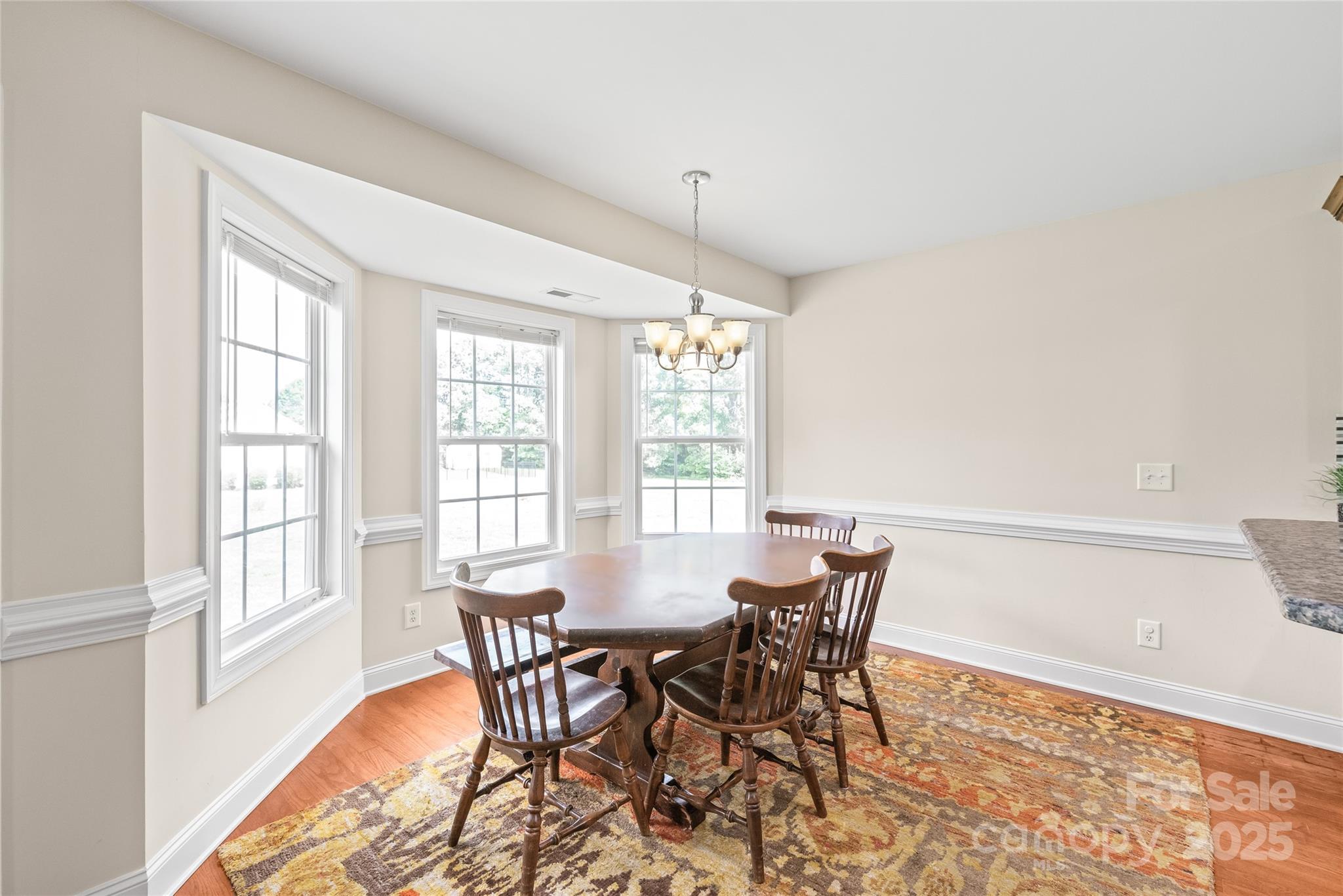 8717 Swift Road Oakboro, NC 28129 - Photo 8 of 23 a view of a dining room with furniture window and outside view