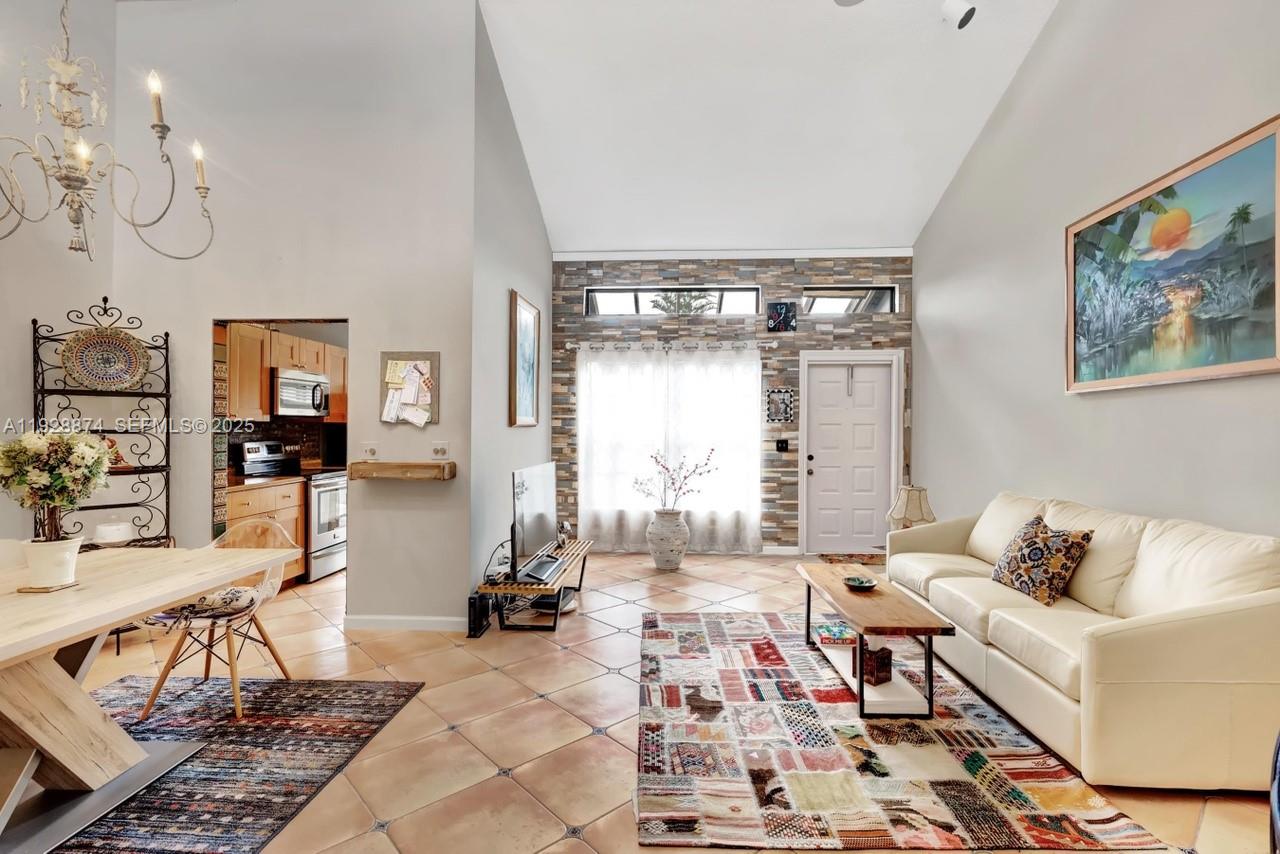 5170 Nesting Way, Unit B Delray Beach, FL 33484 - Photo 3 of 16 a living room with furniture and wooden floor