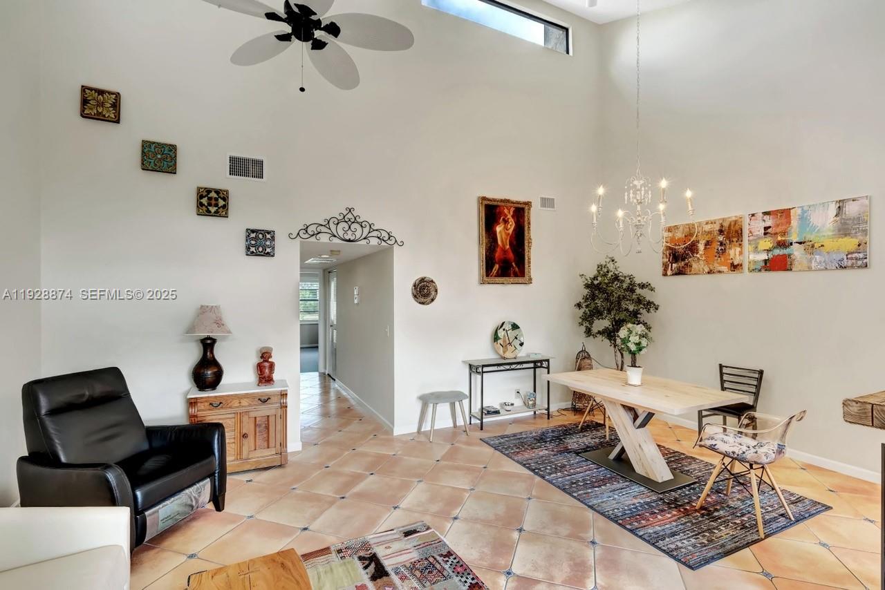 5170 Nesting Way, Unit B Delray Beach, FL 33484 - Photo 4 of 16 a living room with furniture and a potted plant