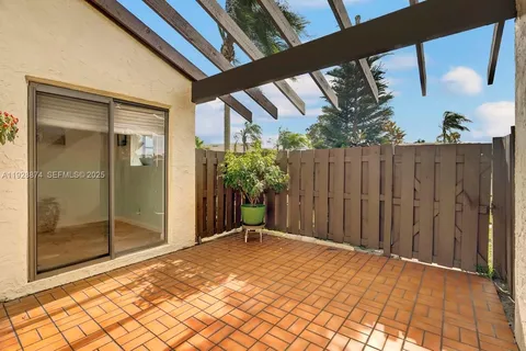 a view of backyard with small cabin