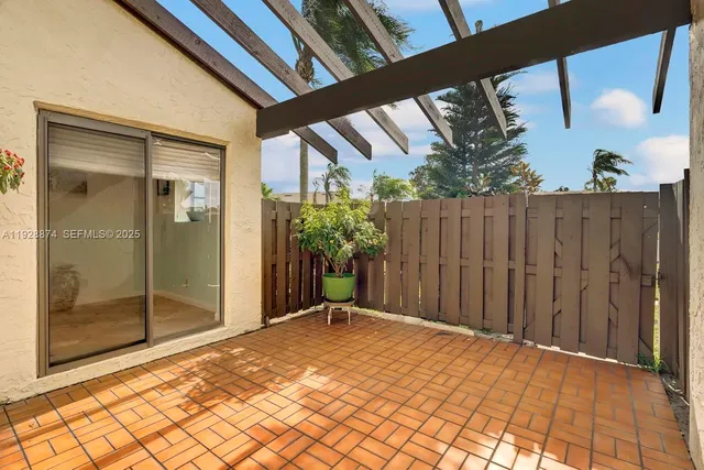 a view of backyard with small cabin