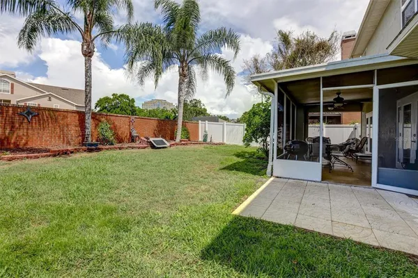a view of a backyard with a sitting area and slide