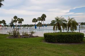 20850 San Simeon Way, Unit 3095 Miami, FL 33179 - Photo 19 of 20 a view of a garden
