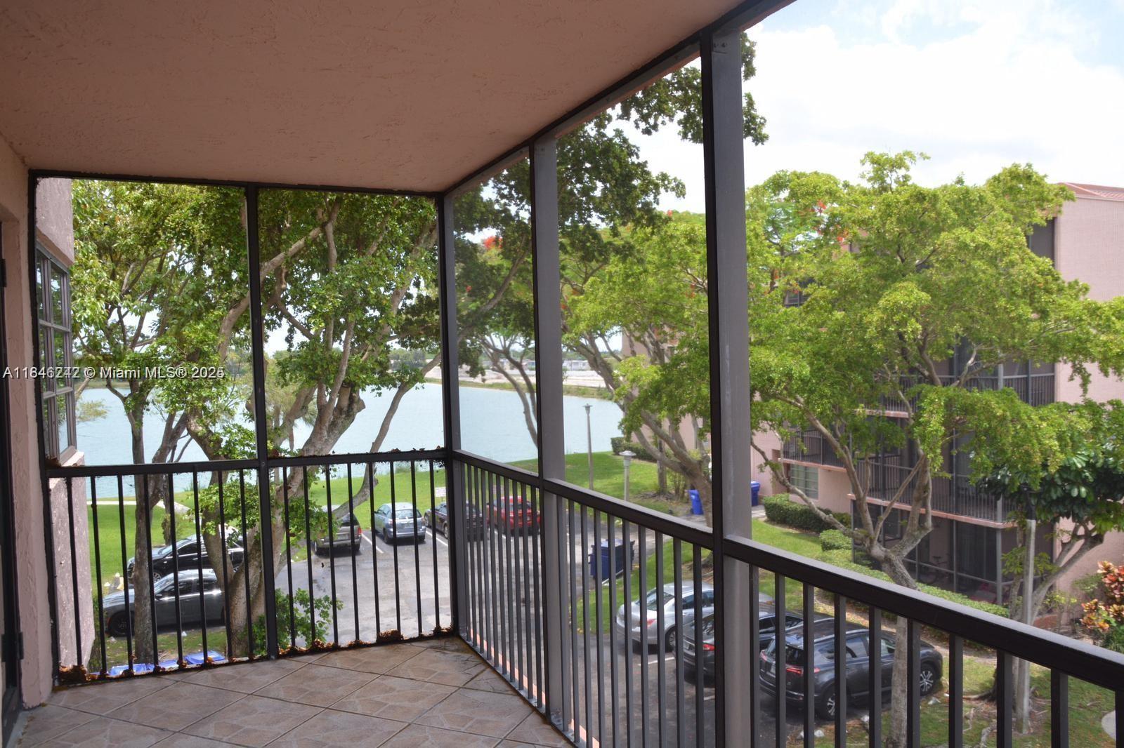 20850 San Simeon Way, Unit 3095 Miami, FL 33179 - Photo 6 of 20 a view of a street from a balcony