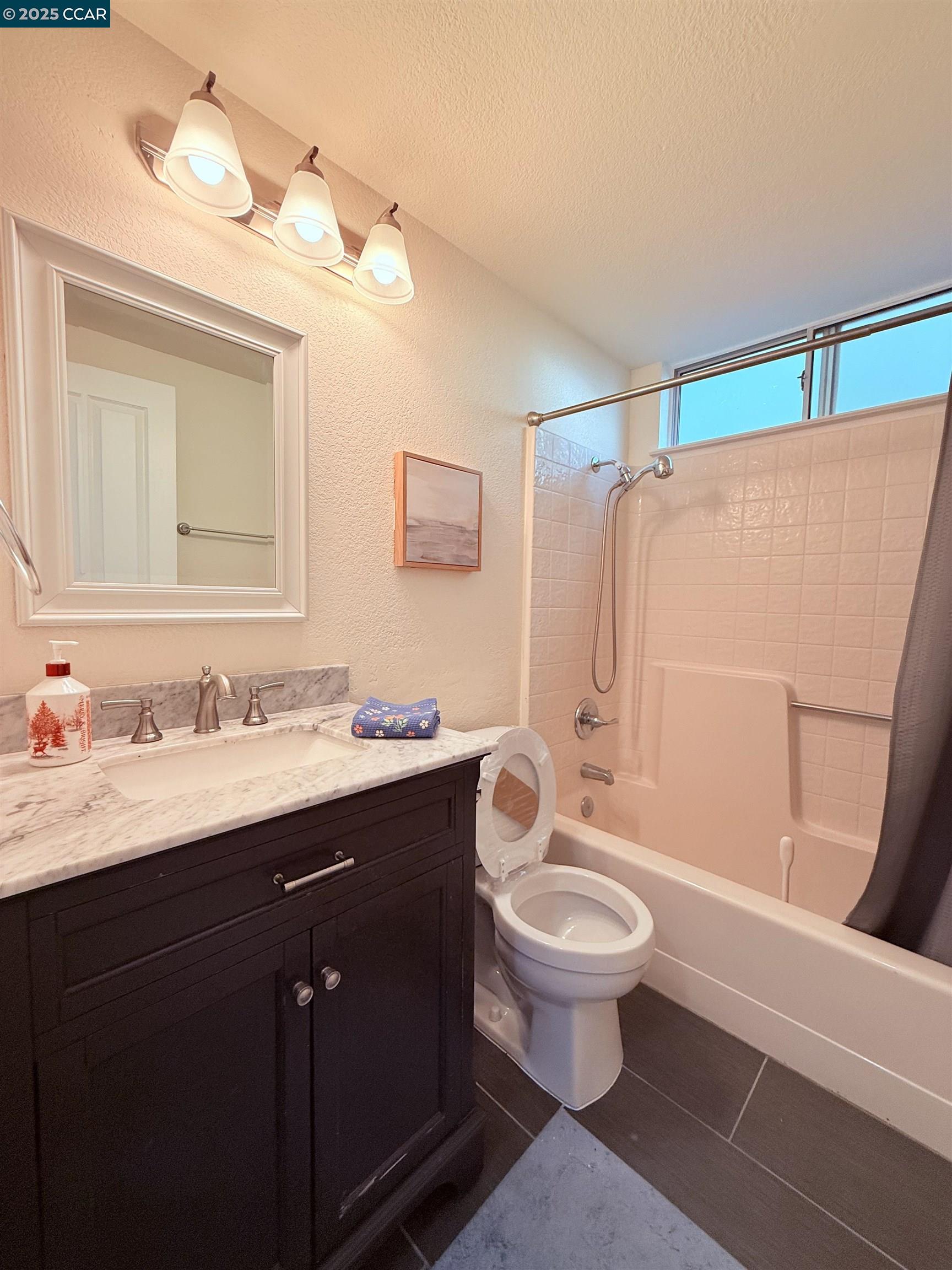 360 Gull Place Pittsburg, CA 94565 - Photo 15 of 36 a bathroom with a granite countertop sink toilet and shower
