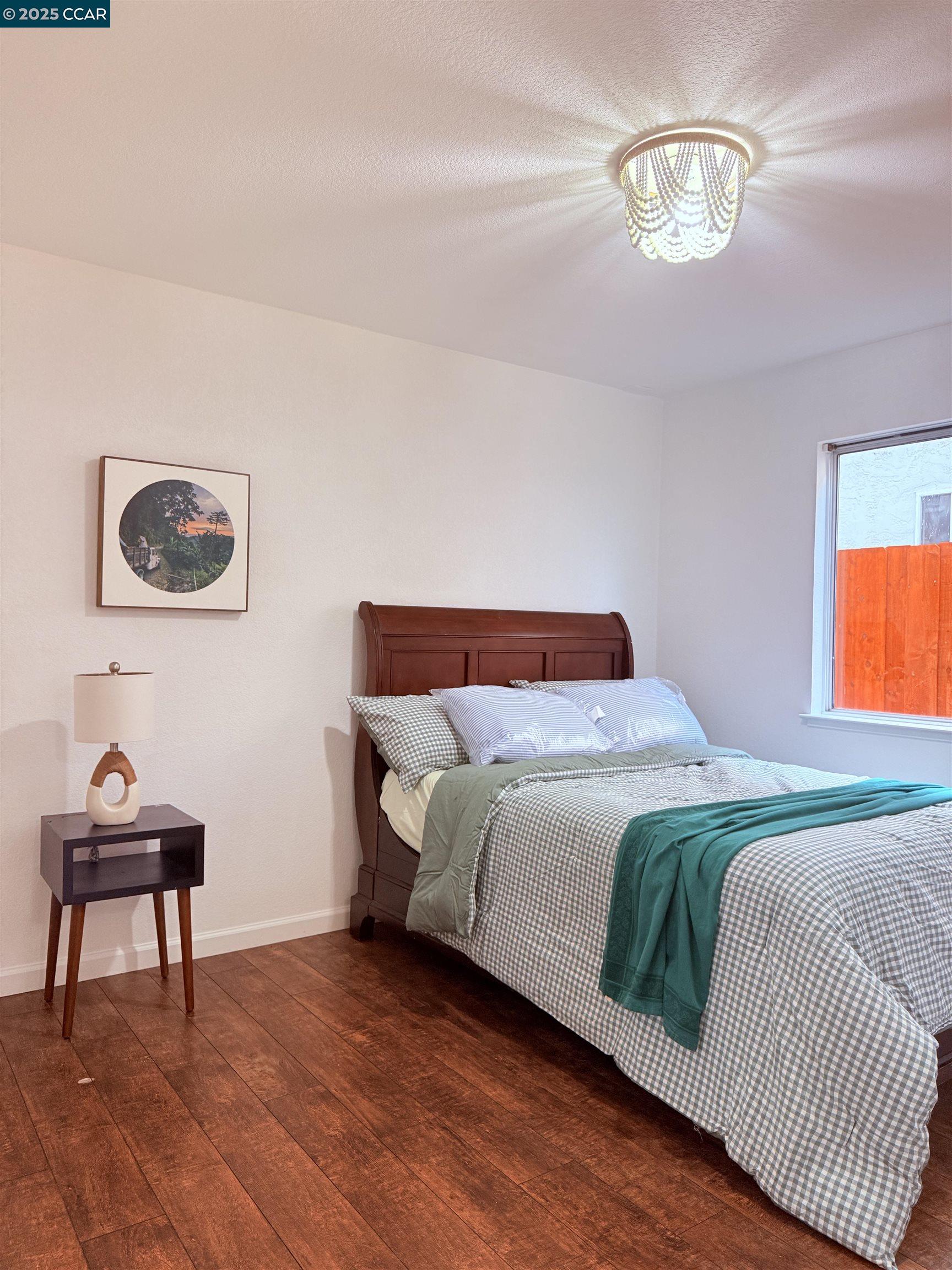 360 Gull Place Pittsburg, CA 94565 - Photo 16 of 36 a bedroom with a bed and painting on the wall