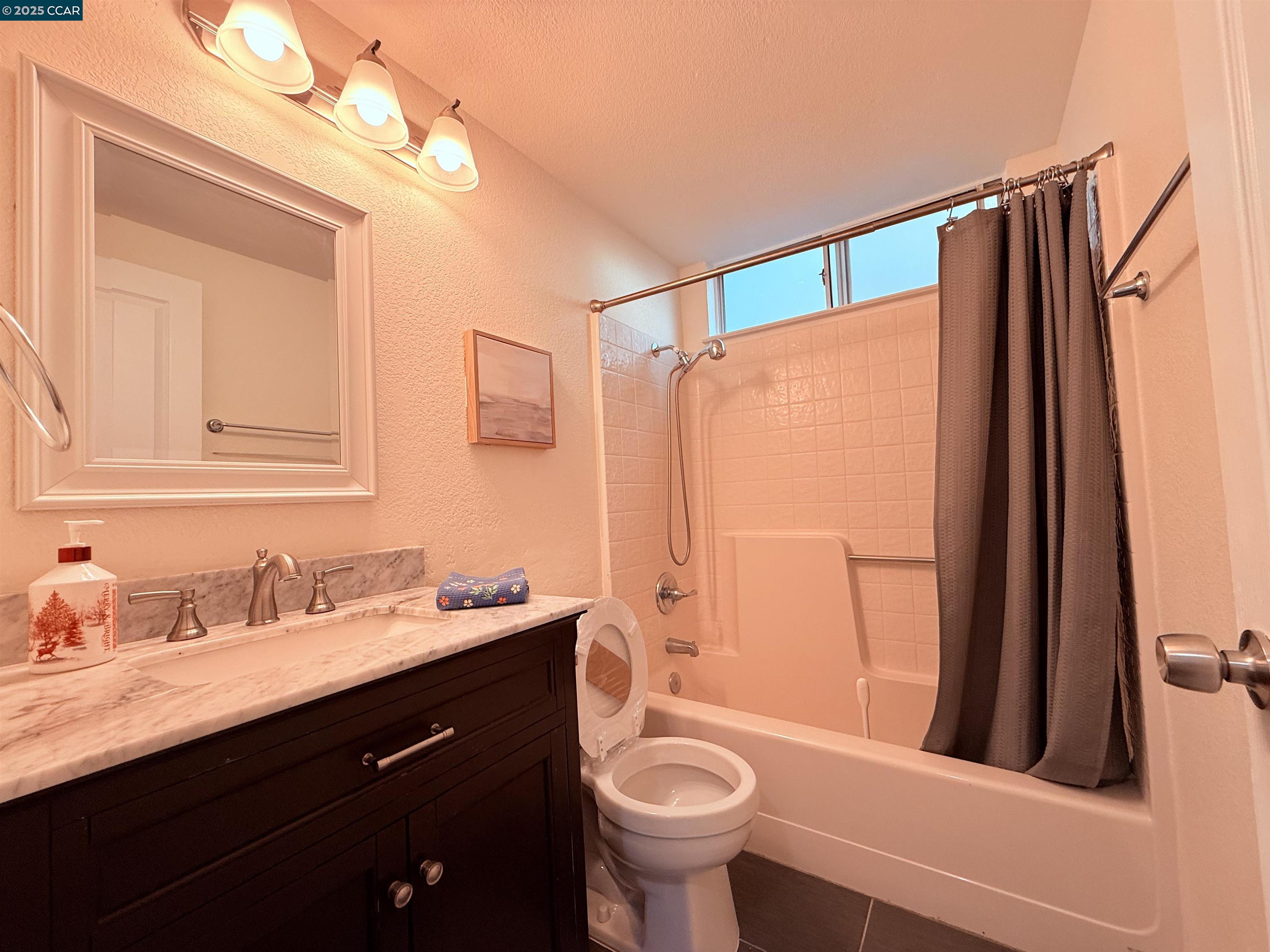 360 Gull Place Pittsburg, CA 94565 - Photo 17 of 36 a bathroom with a sink a toilet a mirror and shower