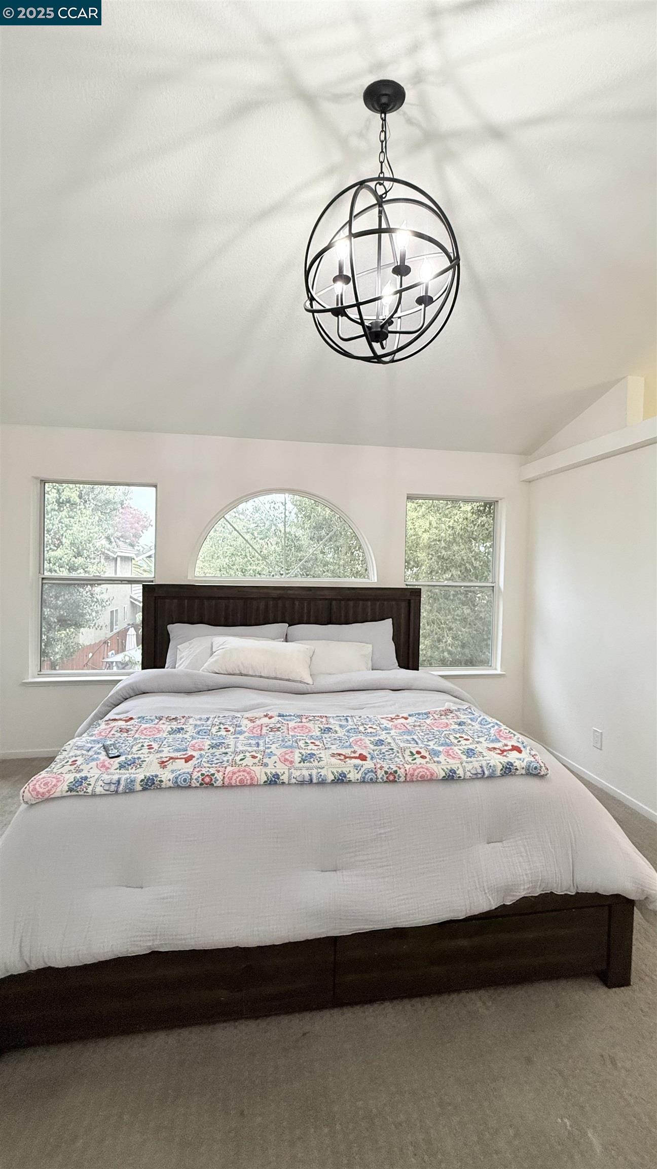 360 Gull Place Pittsburg, CA 94565 - Photo 19 of 36 a bedroom with a bed and a chandelier