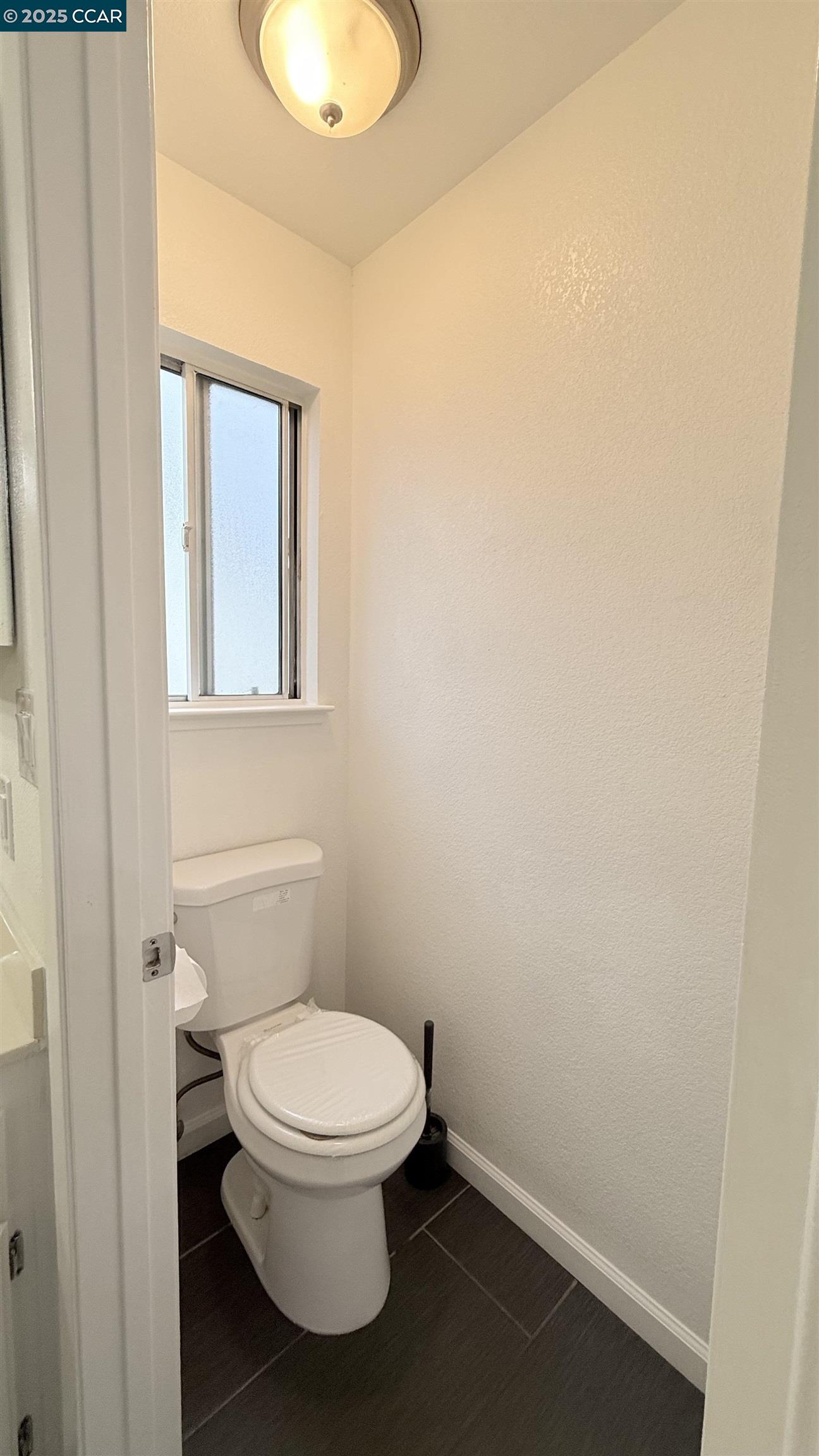 360 Gull Place Pittsburg, CA 94565 - Photo 23 of 36 a white toilet sitting next to a bathroom sink