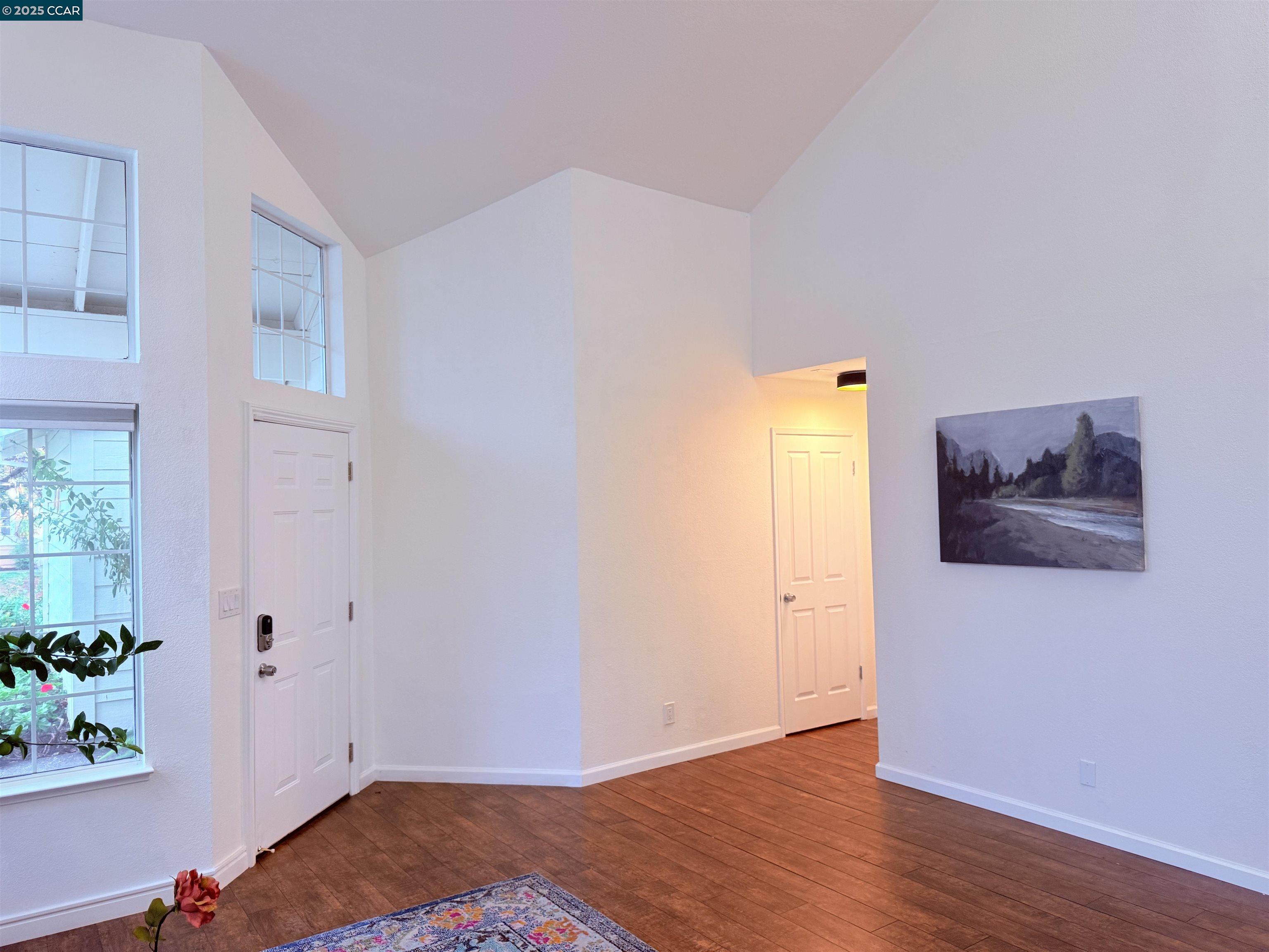 360 Gull Place Pittsburg, CA 94565 - Photo 5 of 36 a view of a room with wooden floor and potted plant