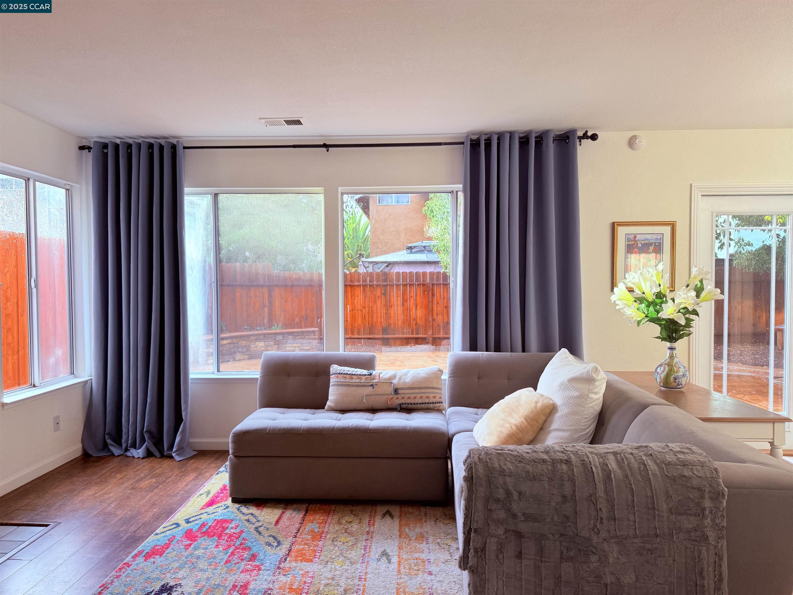 360 Gull Place Pittsburg, CA 94565 - Photo 7 of 36 a living room with furniture and a large window