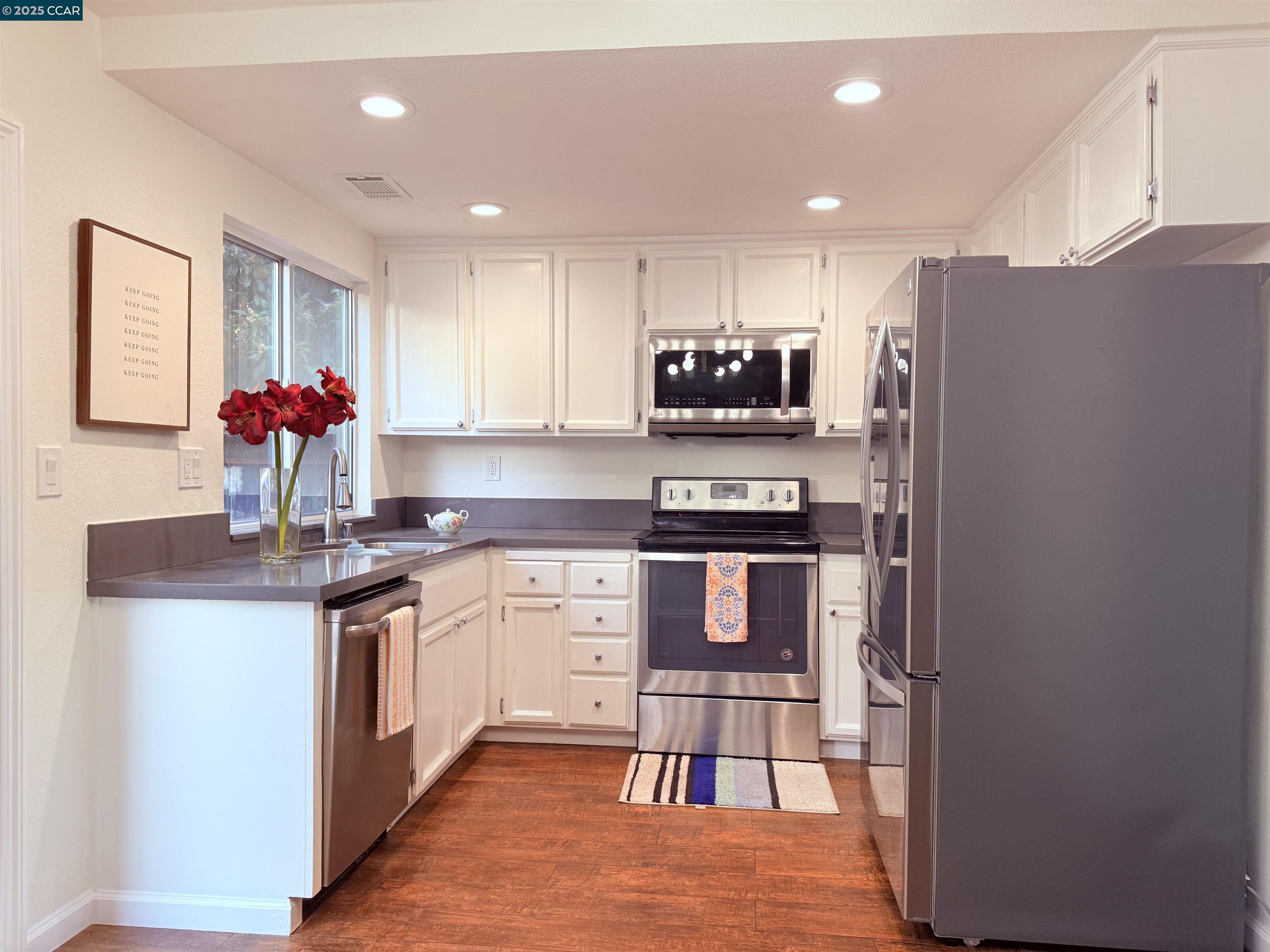 360 Gull Place Pittsburg, CA 94565 - Photo 10 of 36 a kitchen with stainless steel appliances a sink stove and refrigerator