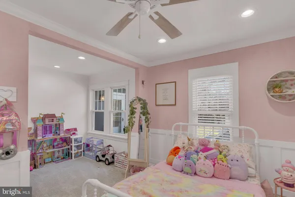 a bedroom with furniture and a window