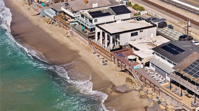 a aerial view of a house with a yard