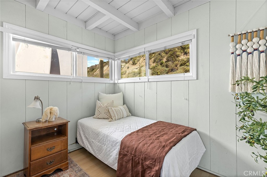 35711 Beach Road Dana Point, CA 92624 - Photo 30 of 47 a bedroom with a bed and a window