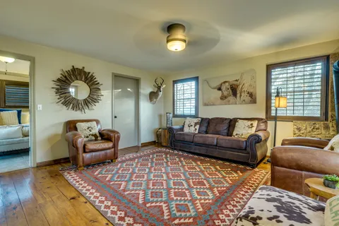 a dining room with furniture and wooden floor