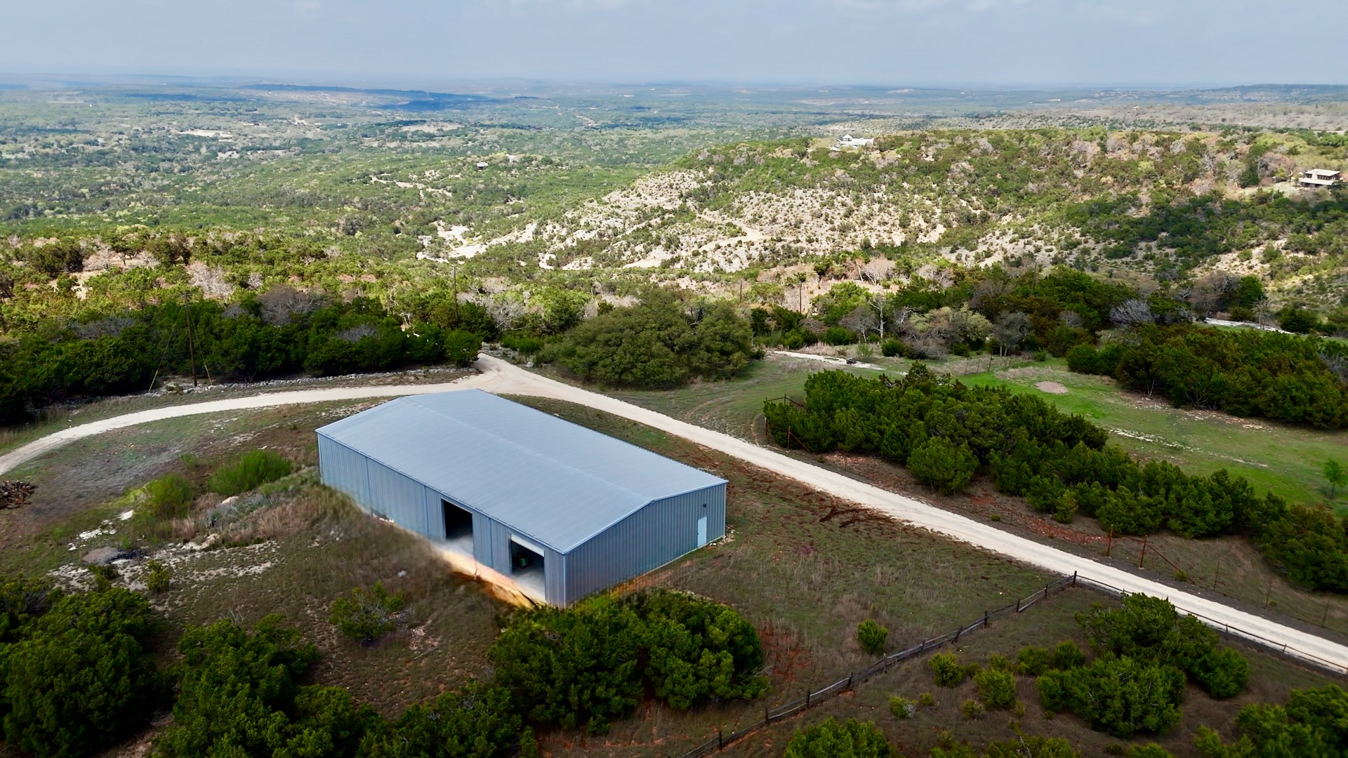 281 Kloster Lane Blanco, TX 78606 - Photo 32 of 40 an aerial view of residential houses with outdoor space and trees