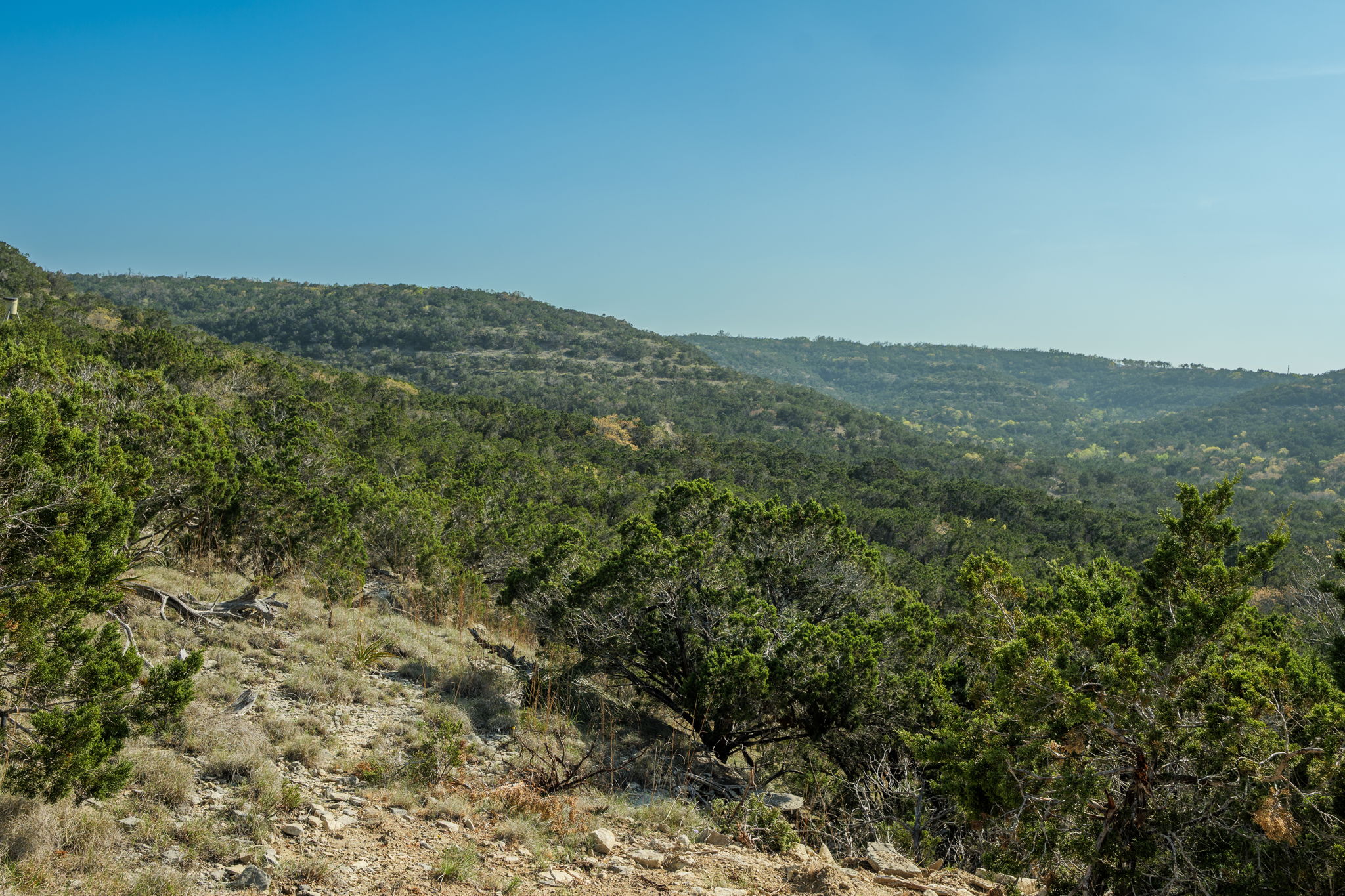 281 Kloster Lane Blanco, TX 78606 - Photo 36 of 40 a view of a large building with mountains in the background