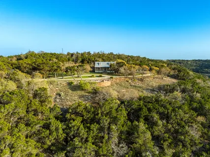 a view of a yard with trees
