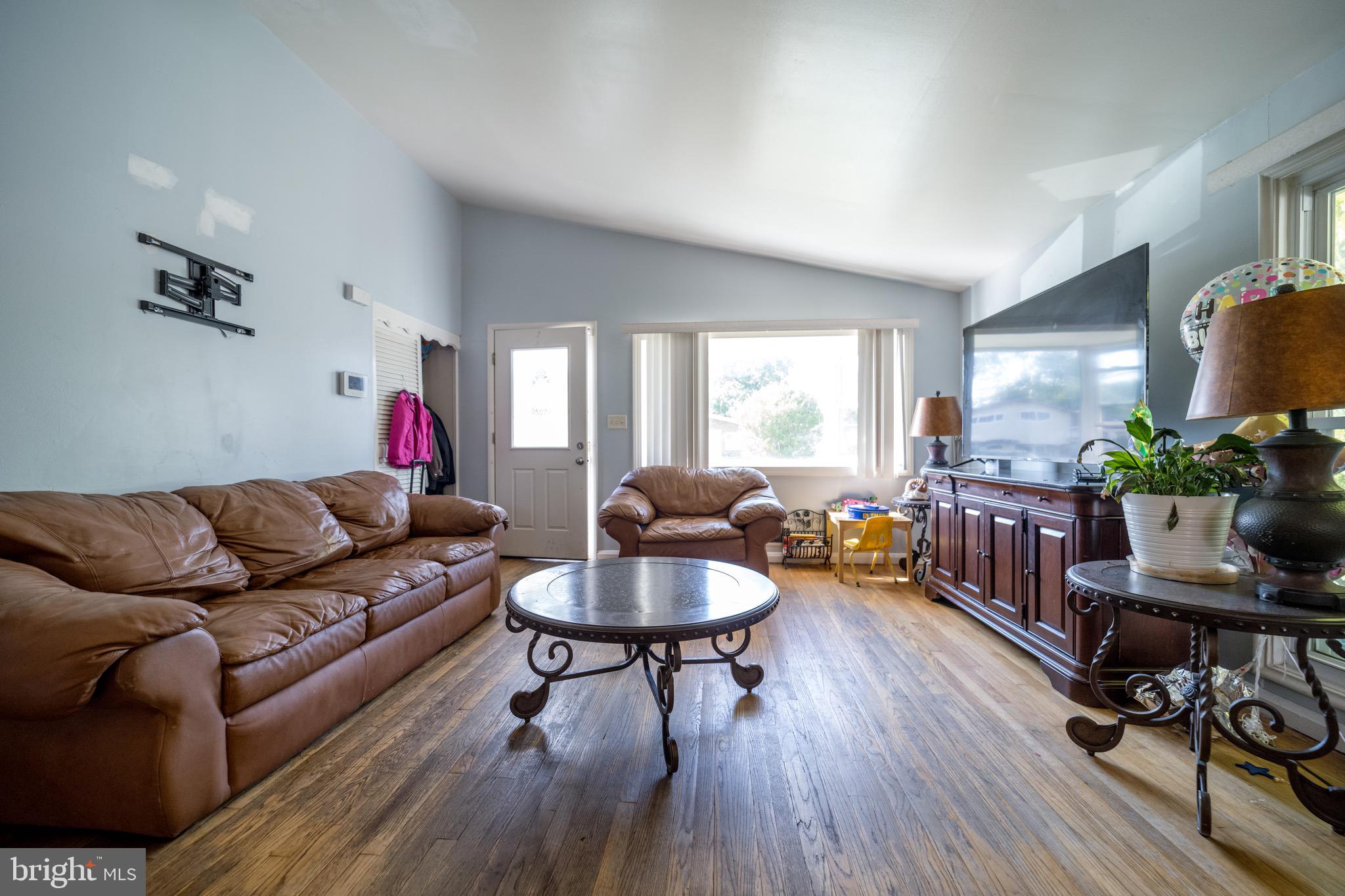 4125 Ronis Road Pikesville, MD 21208 - Photo 2 of 40 a living room with furniture and a wooden floor