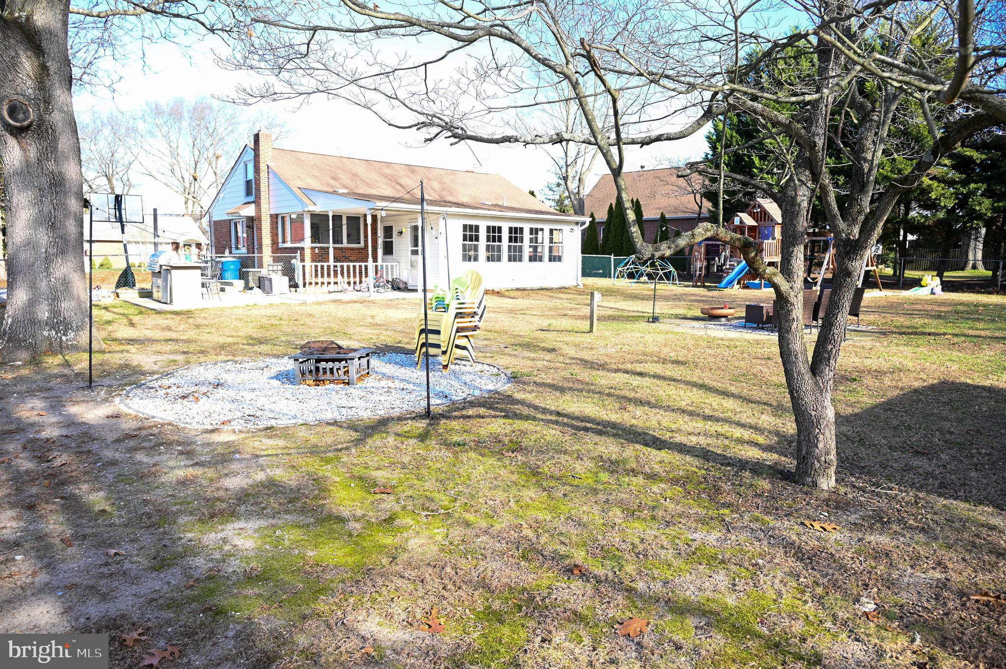 107 Robin Lane Voorhees, NJ 08043 - Photo 15 of 27 a view of a house with swimming pool