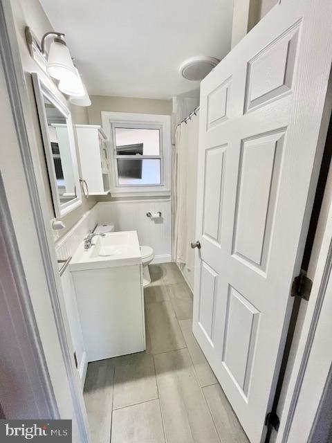 107 Robin Lane Voorhees, NJ 08043 - Photo 16 of 27 a bathroom with a sink a mirror and a toilet
