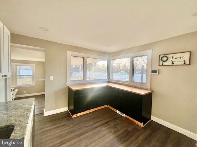 107 Robin Lane Voorhees, NJ 08043 - Photo 7 of 27 an empty room with wooden floor and windows