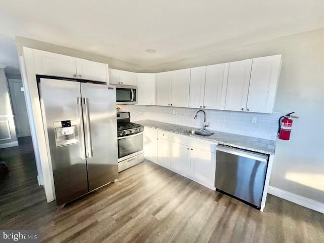 107 Robin Lane Voorhees, NJ 08043 - Photo 8 of 27 a kitchen with granite countertop a refrigerator and a sink
