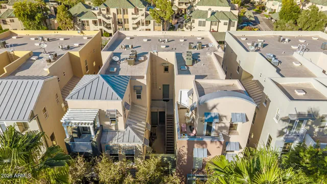 an aerial view of a residential apartment building with a yard